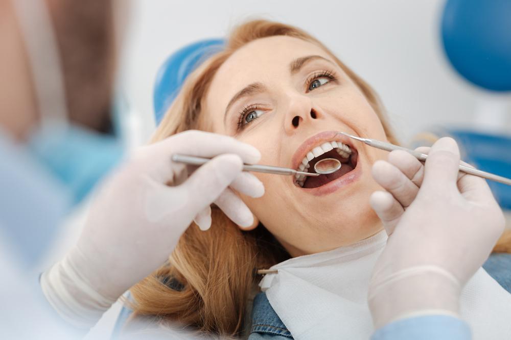 A woman getting a dental examination.